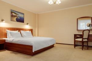 Postel nebo postele na pokoji v ubytování PecherSky Hotel