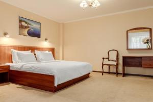 Postel nebo postele na pokoji v ubytování PecherSky Hotel