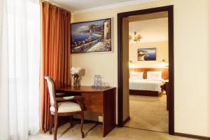 Postel nebo postele na pokoji v ubytování PecherSky Hotel