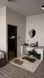 a living room with a table and a mirror at Sea Mê Phú Quý Homestay & Glamping in Cù Lao Thu