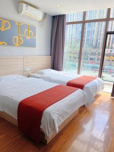 Postel nebo postele na pokoji v ubytování Pudding Select Hotel Sichuan Guang'an Vocational and Technical College Sports Center Store