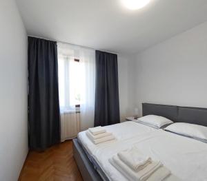 Giường trong phòng chung tại Garden Apartments