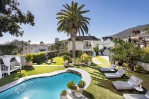 an image of the backyard of a house with a swimming pool at The Clarendon - Fresnaye in Cape Town