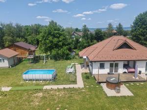 an aerial view of a house with a pool at Freya House Valea Avrigului in Avrig