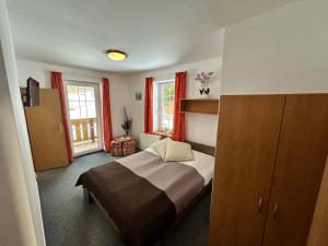 Postel nebo postele na pokoji v ubytování Hotel Vladimír