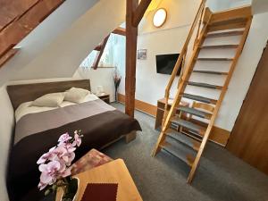 Postel nebo postele na pokoji v ubytování Hotel Vladimír