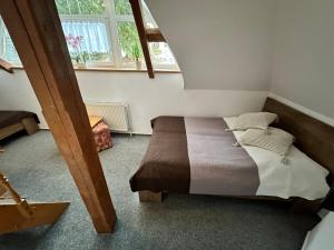 Postel nebo postele na pokoji v ubytování Hotel Vladimír