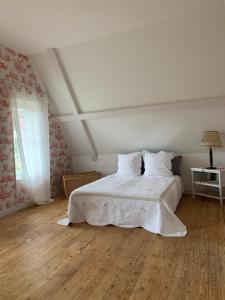 Posteľ alebo postele v izbe v ubytovaní Le Manoir des Rochers