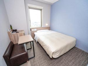 Katil atau katil-katil dalam bilik di Super Hotel Shiga Nagahama Tennen Onsen