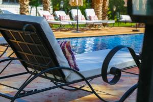 Swimmingpoolen hos eller tæt på Villa Palmyra, 8 suites et piscine chauffée