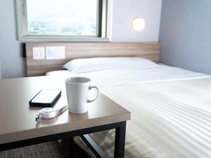 Katil atau katil-katil dalam bilik di Super Hotel Shiga Nagahama Tennen Onsen