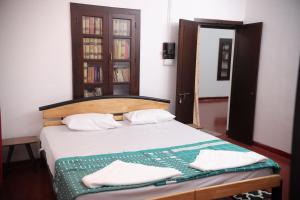 Кровать или кровати в номере Pudumana Homestays +3 фотографии