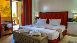 En eller flere senge i et værelse på Villa Palmyra, 8 suites et piscine chauffée