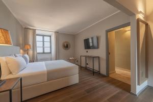 Palazzo Massaini - Le Scuderie客房内的一张或多张床位