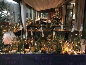 a christmas display in a restaurant with christmas trees at La Place Boutique Hotel in Antibes
