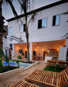 a villa with a swimming pool and a house at Luxury entire Private Villa Paje Beach Zanzibar TV WIFI AC private garden and cascading waterfall pool steps to the beach and amentites in Paje