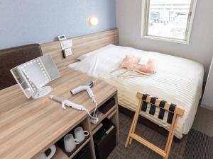 Katil atau katil-katil dalam bilik di Super Hotel Shiga Nagahama Tennen Onsen