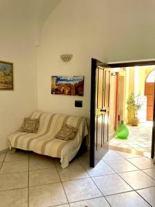 a bedroom with a bed in the corner of a room at Mary Apt - Historical Residence- Lecce in Lecce