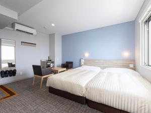 Katil atau katil-katil dalam bilik di Super Hotel Shiga Nagahama Tennen Onsen