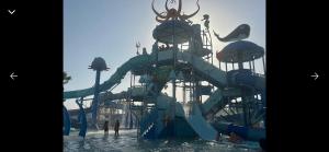 a water slide in the water at a water park at Blue Bay Appart hôtel in Monastir