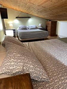 Postel nebo postele na pokoji v ubytování Casa Rural Jim Morrison