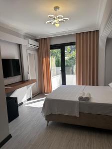 Postel nebo postele na pokoji v ubytování KILIÇ MOTEL