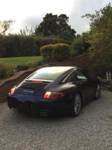 a black car parked on the side of a driveway at L'Horizon de la Côte d'Opale in Hesdin-lʼAbbé