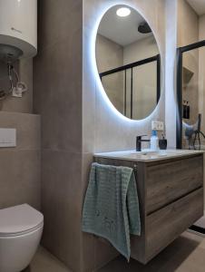 a bathroom with a sink and a mirror at Cal Ticó, 6 guests Monistrol de Montserrat in Monistrol