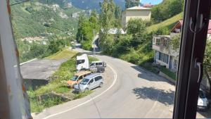 a view from a window of a road with trucks at KESKİN günü birlik konut in Macka
