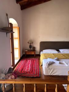 Postel nebo postele na pokoji v ubytování Duni Roots Heritage Stay