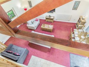 an overhead view of a living room with red carpet at Cedar Barn - Ukc5406 in Banham +17 photos