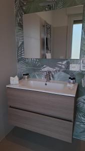 a bathroom with a sink and a mirror at Al parco1 in Termoli