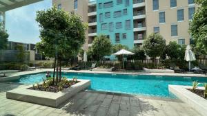 Bazén v ubytování Apartment With Private Garden at Al Zahia - Garden Haven nebo v jeho okolí