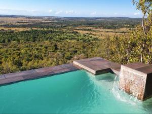an overhead view of a pool of water with a view at Lion and Cheetah Sanctuary in Cullinan