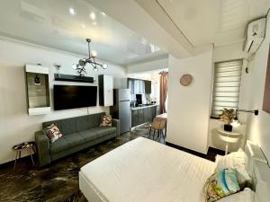 a living room with a couch and a living room with at Studio CAMIS in Năvodari