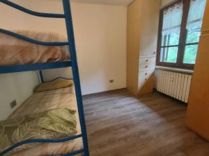 Postel nebo postele na pokoji v ubytování appartamento marmotta