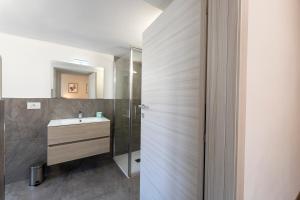 a bathroom with a sink and a shower at Casa di Gio in Cavalese +27 photos