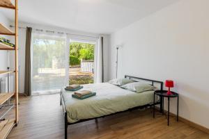 Postel nebo postele na pokoji v ubytování Villa les Oliviers