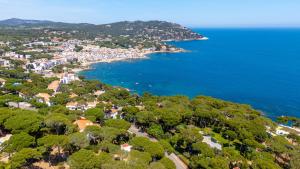 an aerial view of a town next to the ocean at Apartments Cap de Planes Calella de Palafrugell - by EMERALD STAY in Palafrugell +102 photos
