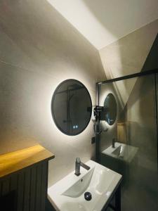 a bathroom with a sink and a mirror at Apartament u Jagi Sądelska 119f in Murzasichle +23 photos