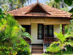 Zahrada ubytování Maadathil cottages & Beach Resort