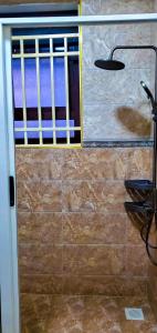 a door with a window in a room at Ayan homes in Namulanda