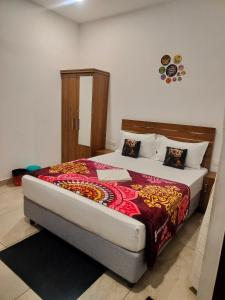 Postel nebo postele na pokoji v ubytování Asprin Homestay