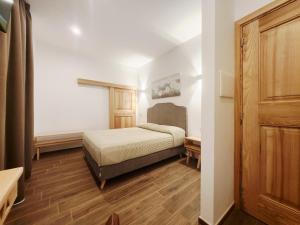 Ένα ή περισσότερα κρεβάτια σε δωμάτιο στο Residenza Tittinu