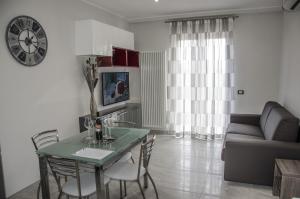 A television and/or entertainment centre at Versilia Residence