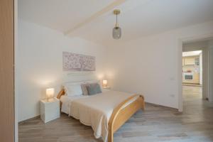 Ένα ή περισσότερα κρεβάτια σε δωμάτιο στο Cozy Flat - nel Cuore di Santa Maria - ItalyWeGo