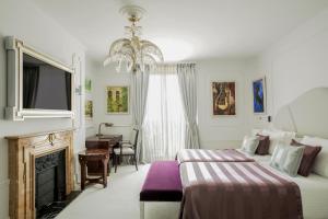 Postel nebo postele na pokoji v ubytování Hotel El Palace Barcelona