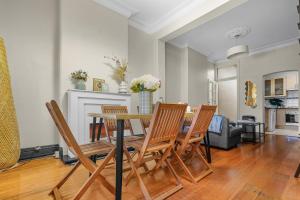 a dining room with a table and chairs at 2 Bedroom House Surry Hills Good for 6 Guests in Sydney