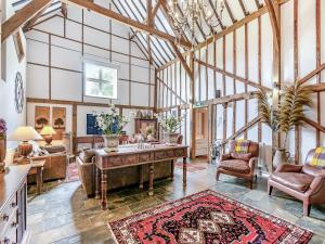 a large living room with a table and chairs at The Barn - Uk49371 in Send