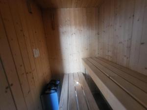 an empty sauna with a blue trash can in it at Le conviviale in Belfort